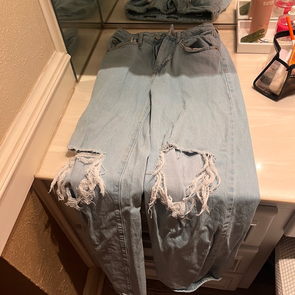 Distressed light wash wide leg jeans